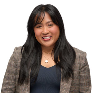 Associate attorney Nicole Ramos, captured in a headshot with long black hair and a brown suit jacket.